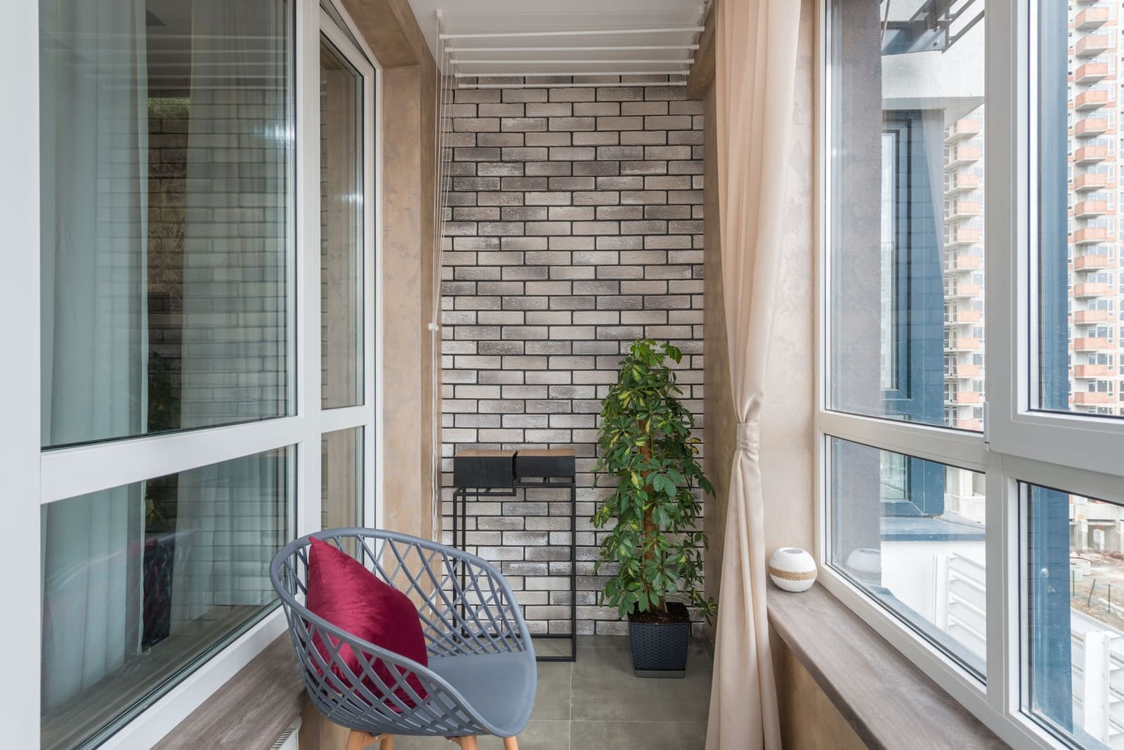 Shaded outdoor terrace seating at an NIBM Road villa