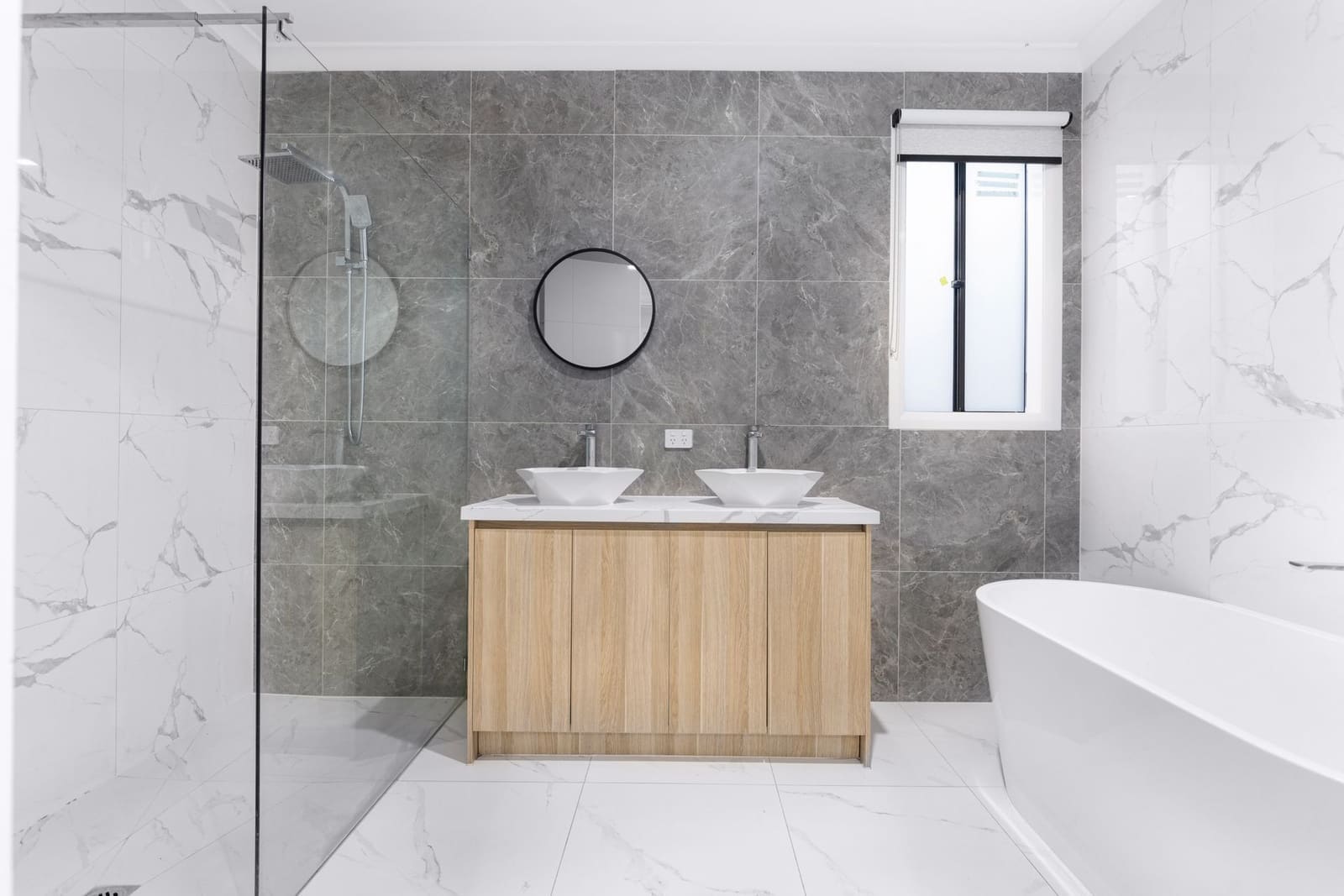 Renovated bathroom with new fittings and tiling
